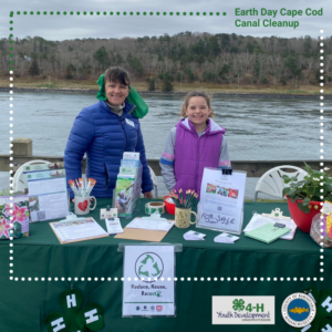 4-H members and program coordinator, Sandi Shepherd-Gay greeting folks at their event table.