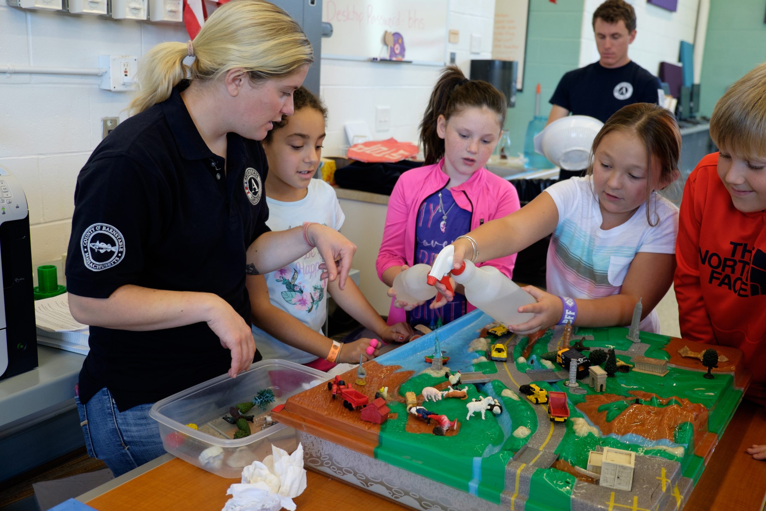 kid spraying water americorps teaching kids