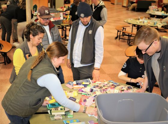 LeHac Program Supervisor, Phoebe Plank, sorts donations at the 2020 MLK Day event.