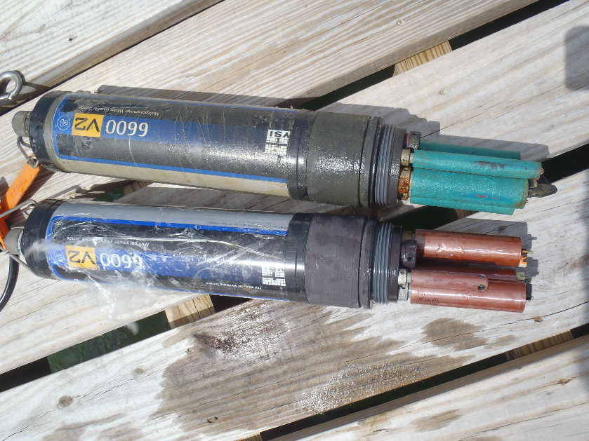 Water quality monitoring sondes. The actual sensors are the green and copper colored cylinders on the right side.