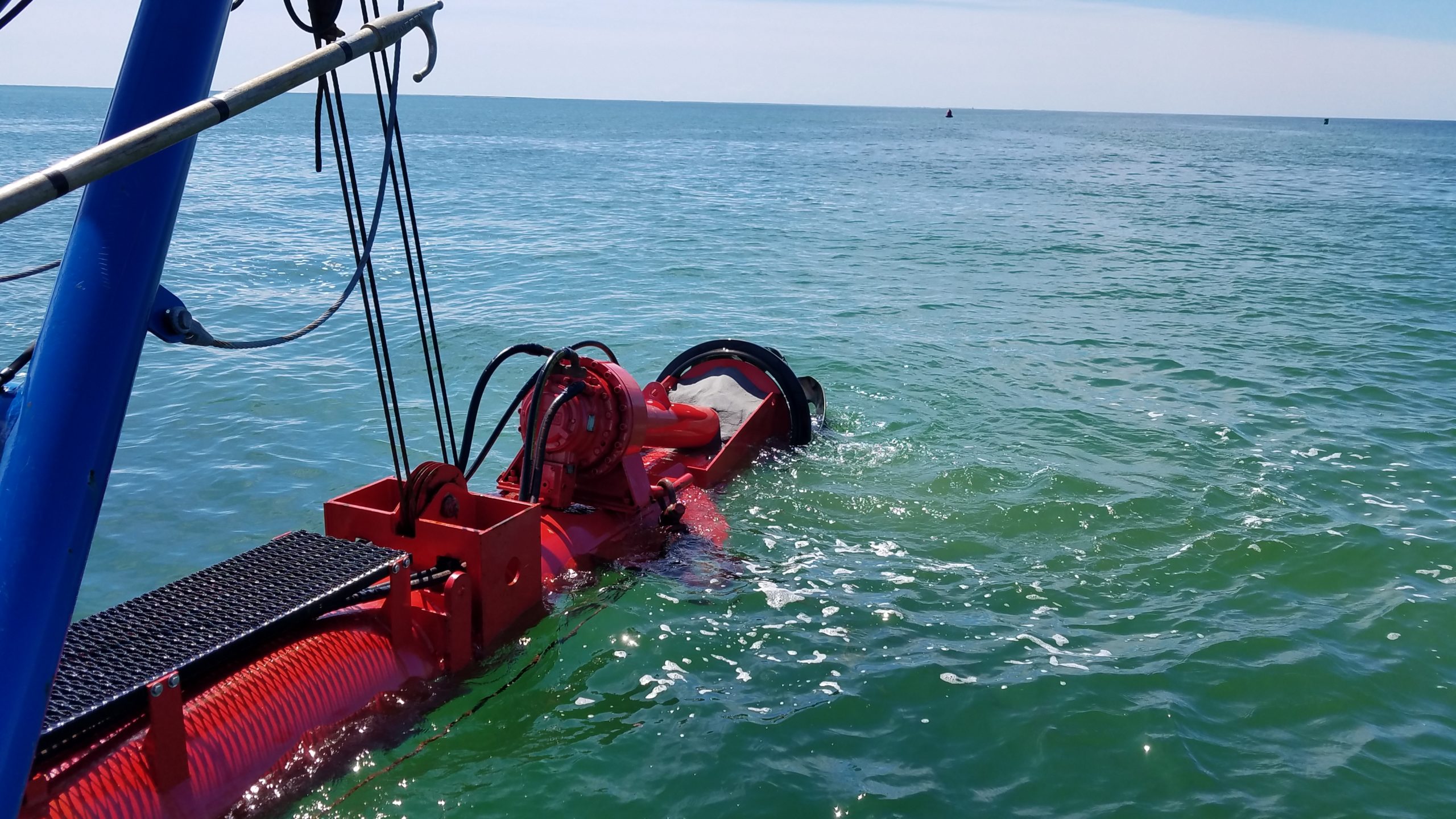 Cutterhead being lowered to restart dredging.