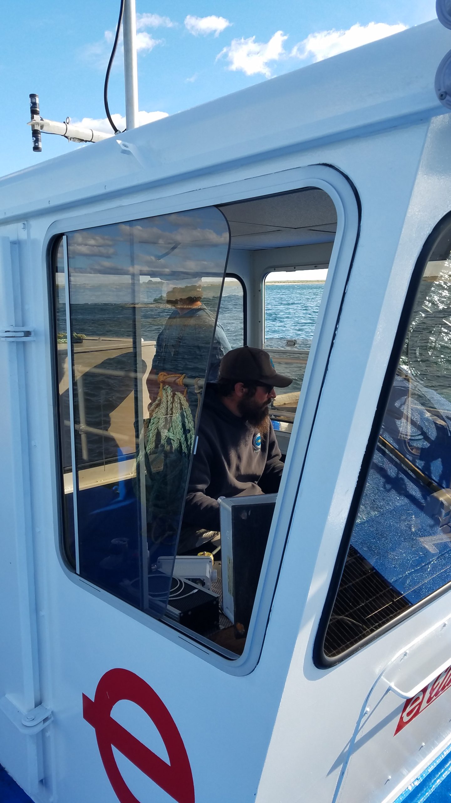 Leverman Cory Fleming onboard Cod Fish II in the 1916 channel in Popponesset Bay