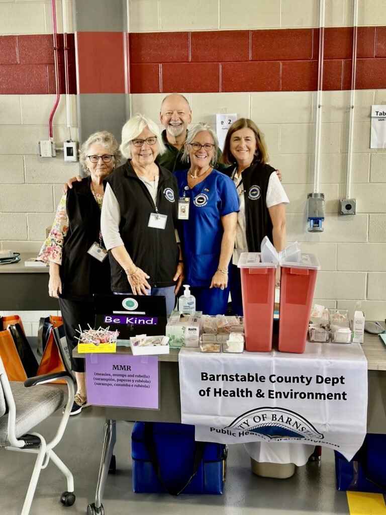 Barnstable County's Public Health Nursing Team manning the vaccine table.