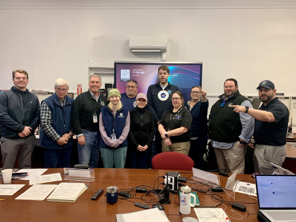 Pictured here in the Multi-Agency Coordination Center (MACC), representatives from Barnstable County, Eversource, AmeriCorps Cape Cod, the Department of Conservation and Recreation (DCR), and the Massachusetts Emergency Management Agency (MEMA) worked side by side throughout the storm response.