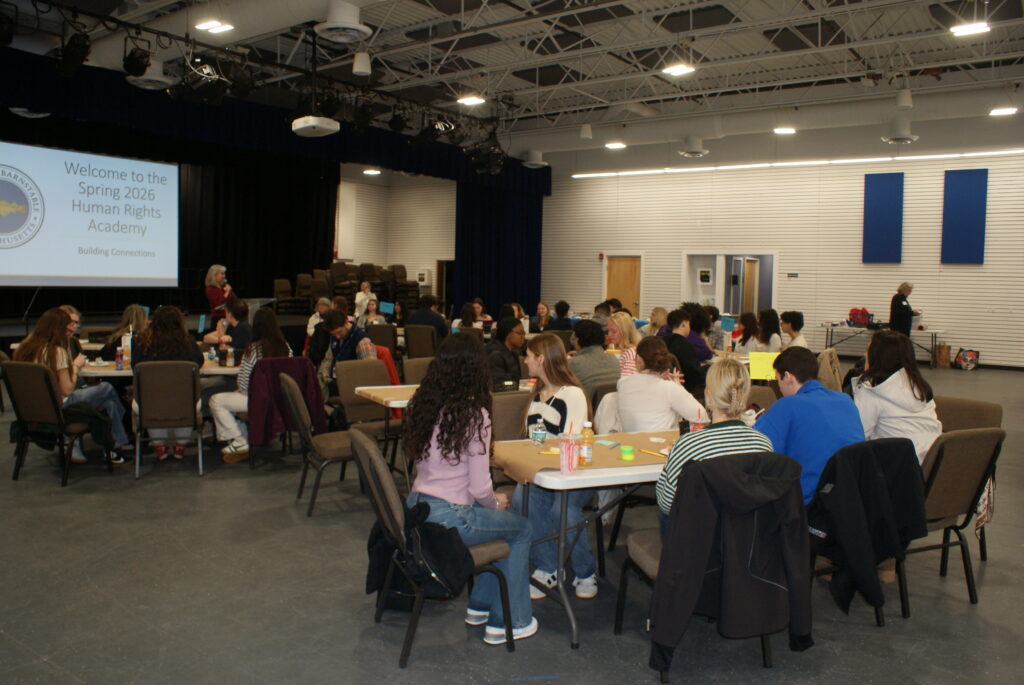 Students participate in the 2026 Human Rights Academy, collaborating in small groups during a day of learning focused on community connections, civic engagement, and human rights leadership.