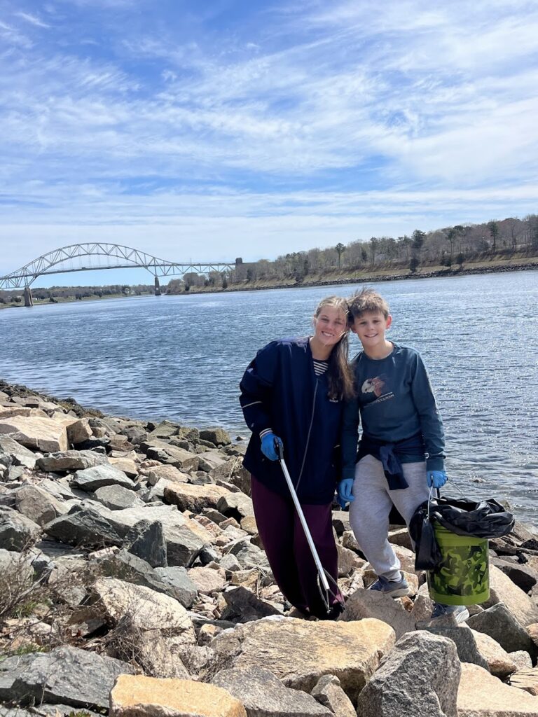 Volunteers collect trash during the Canal Cleanup along the Cape Cod Canal.